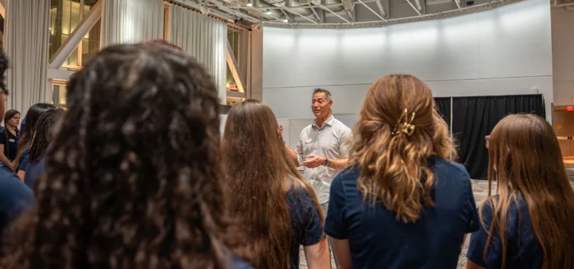 Man Talks to Teen Ambassadors Image