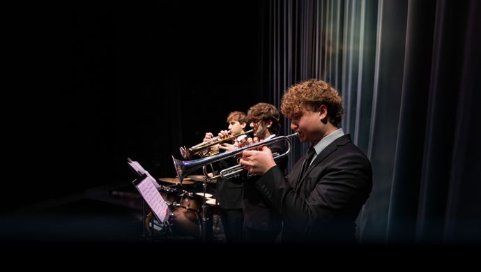 Youth Orchestra Performing in a Concert Hall