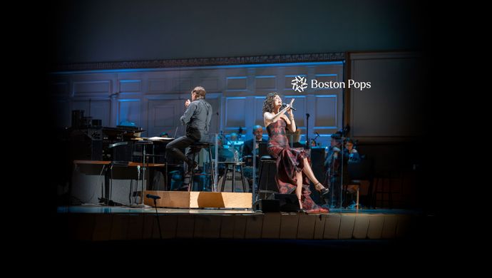 Boston Props Conductor Leading Orchestra with Vocalist on Stage