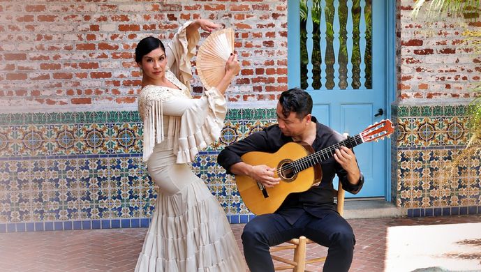Flamenco Guitarist and Dancer Performing Together